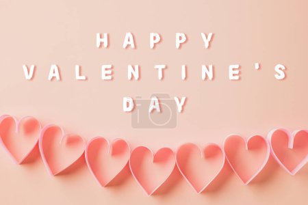 Téléchargez les photos : Happy Valentines Day. Flat lay pink ribbon heart shaped decorative on pastel pink background, love holiday concept, banner design, Festive background with copy space, Mother, Woman day - en image libre de droit
