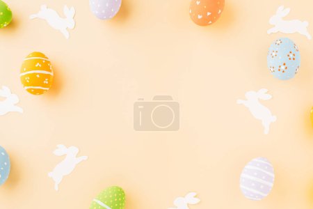 Téléchargez les photos : Easter eggs bunny and rabbit white paper cutting isolated on pastel background, Funny decoration, Festive composition banner web design holiday background, Happy Easter Day - en image libre de droit