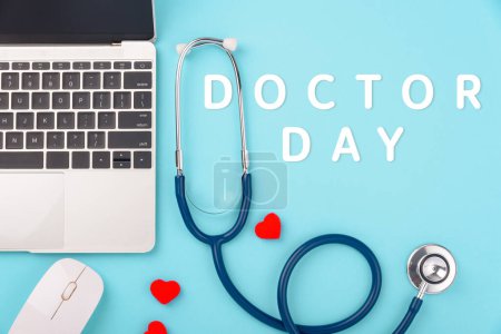 Photo for Doctors Day concept, flat lay doctor stethoscope with laptop computer and diagnosis heart disease isolated on blue background with copy space for text, Medical and Health care insurance - Royalty Free Image