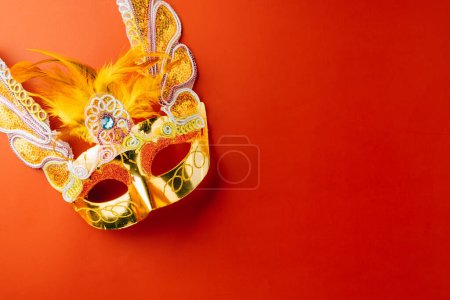 Photo for Happy Purim carnival. Carnival mask for Mardi Gras celebration isolated on red background banner design with copy space, jewish holiday, Purim in Hebrew holiday carnival ball, Venetian mask - Royalty Free Image