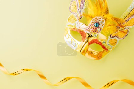 Photo for Happy Purim carnival accessories. Carnival mask for Mardi Gras celebration isolated on pastel green background, jewish holiday, Purim in Hebrew holiday carnival ball, Venetian mask - Royalty Free Image