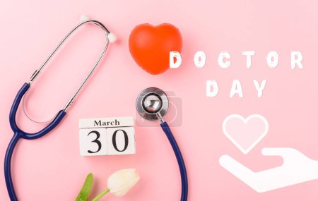 Photo for Doctor Day Concept, Above overhead of equipment medical red heart, doctor stethoscope and tulip flowers on pink background, care patient in hospital with copy space, Medical and Health care insurance - Royalty Free Image