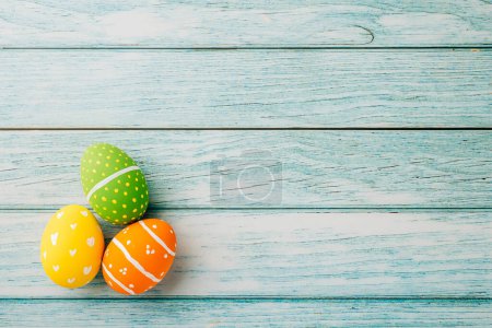 Photo for Happy Easter Day Concept. Top view holiday banner background web design white colorful easter eggs painted on blue wood background with empty copy space, celebration greeting card, overhead, template - Royalty Free Image