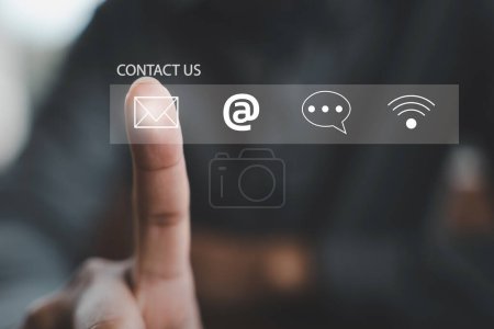 Photo for People connect through contact us or customer support hotline. finger touch to access contact icons email, address, live chat on virtual screen. Internet wifi represents digital communication. Banner - Royalty Free Image