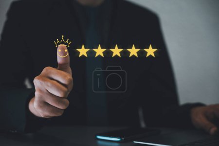 Photo for Customer satisfaction guaranteed. A hand showing a thumbs up and five-star rating symbol, reflecting trust, loyalty, and great service. Ideal for business and marketing reviews, feedback, and surveys - Royalty Free Image