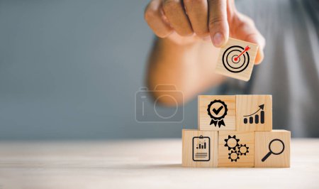 Photo for Wood block stacking by hand, showcasing the essence of business strategy and Action plan. Copy space for professional use, emphasizing the concept of growth. - Royalty Free Image