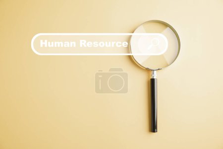 Photo for HRM insight Magnifier glass zooms in on manager icon in staff icons, representing the valuable role of human resource management in recruitment, leadership, and customer targeting. employees selection - Royalty Free Image
