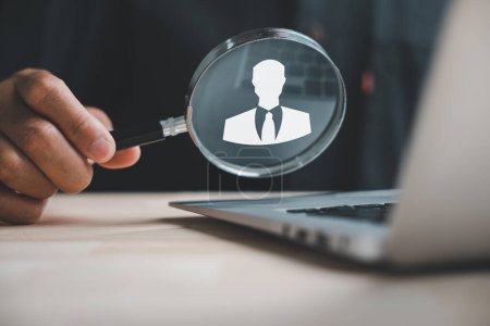 Photo for HRM perspective Magnifier glass focuses on manager icon, symbolizing the strategic approach of human resource management in human development, recruitment, and leadership. employees selection - Royalty Free Image