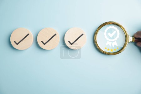 Photo for Certification and ISO quality concept, magnifying glass highlighting an aligned icon representing quality assurance certificate. Organization must possess a certificate for confidence in good service. - Royalty Free Image