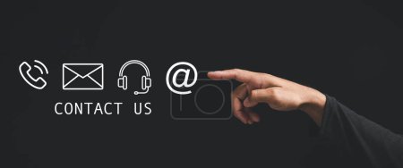 Photo for People connect through contact us or customer support hotline concept. finger touch to access contact icons email, address on virtual screen. Internet wifi represents digital communication. Banner - Royalty Free Image