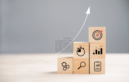 Photo for Business target concept with wooden block cude step. Action Plan and Goal icons represent success. Project management and company strategy on a table. Teamwork background. - Royalty Free Image