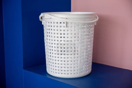 Photo for Laundromat convenience store. Empty new white plastic laundry clothes basket at convenience store for support customer, Laundry and housework concept - Royalty Free Image