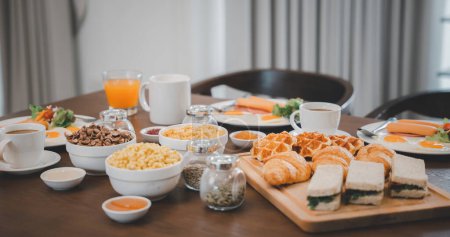 Téléchargez les photos : Breakfast served food with beverage coffee, orange juice on table in the morning at home, Fresh and bright continental breakfast healthy - en image libre de droit