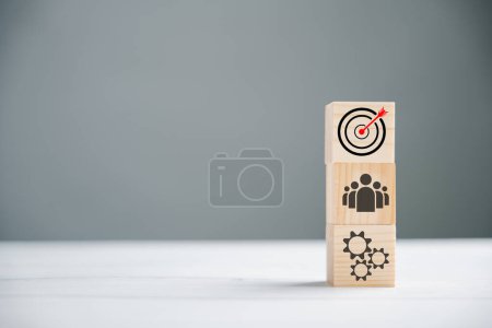 Photo for Action Plan, Goal, and Target icons on a wooden cube block step. Success and business target concept. Project management and company strategy symbolize progress. - Royalty Free Image