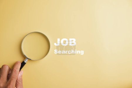 Photo for Conceptual image of a magnifying glass magnifying JOB text, representing search for employment, career advancement, and finding perfect job fit. job search - Royalty Free Image