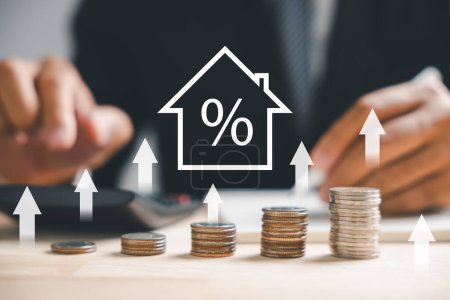 Photo for The real estate market flourishes, highlighted by an upward graph and an up arrow. A house model and coin stack portray inflation, economic growth, and insurance service prices. Property value gains. - Royalty Free Image