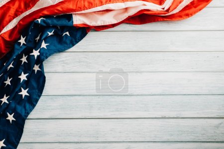 Photo for Veterans Day tribute, American flags against a wooden backdrop, a symbol of honor, unity, and freedom. November 11, a day to celebrate our patriots and the nations glory. - Royalty Free Image