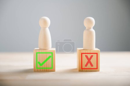 Photo for People demonstrate right and wrong on wooden blocks contemplating yes or no. Business dilemma shown with true and false symbols. Decision-making concept on wood. Think With Yes Or No Choice. - Royalty Free Image