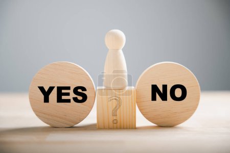 Photo for Wooden block choice showcases peoples conflict between right and wrong contemplating yes or no decisions. True and false symbols on wood illustrate business dilemmas. Think With Yes Or No Choice. - Royalty Free Image