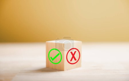 Photo for Wooden block presents green check mark and red x symbolizing decision making. Choice concept. Think With Yes Or No Choice. - Royalty Free Image