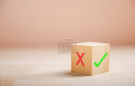Photo for Decision-making concept portrayed by wooden blocks green check mark and red x. Choice symbolism shown. Think With Yes Or No Choice. - Royalty Free Image
