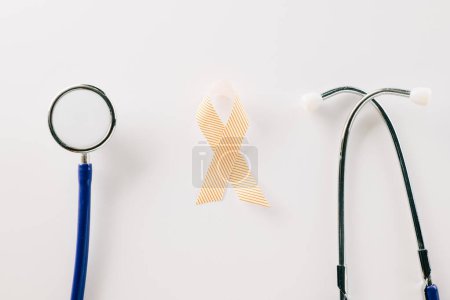 Foto de Pink awareness ribbon sign and stethoscope of International World Cancer Day campaign month isolated on white background with copy space, concept of medical and health care support, 4 February - Imagen libre de derechos