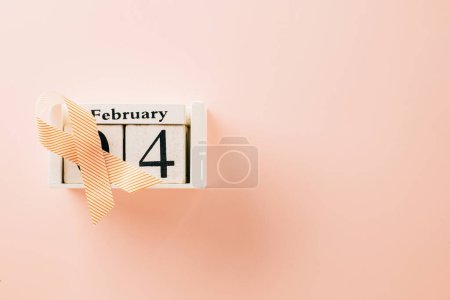 Photo for Pink awareness ribbon sign and Calender 4 February of World Cancer Day campaign on pastel pink background with copy space, concept of medical and health care support - Royalty Free Image
