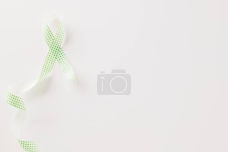 Photo for Green awareness ribbon symbol of Gallbladder and Bile Duct Cancer month isolated on white background with copy space, concept of medical and health care support, Cancer awareness, World bipolar day - Royalty Free Image