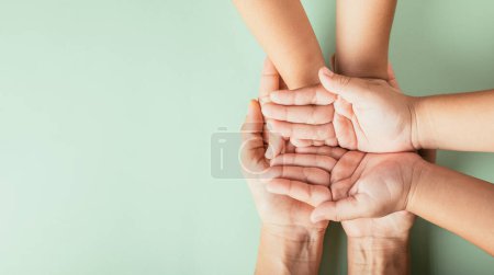 Photo for Celebrating Family Day, Top view of parents and kid holding empty hands. Expressing togetherness support and generational heritage. - Royalty Free Image