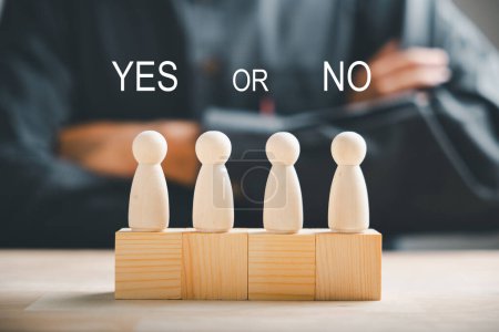 Photo for Wooden cube with peg dolls, yes or no choices. Mans decision-making shown with two options. Red question mark enhances the concept. Think With Yes Or No Choice. - Royalty Free Image