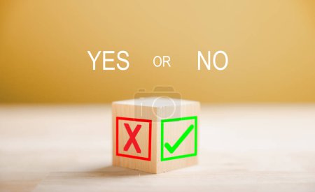 Photo for Green check mark and red x on wooden block signify decision making. Choice concept presented. Think With Yes Or No Choice. - Royalty Free Image