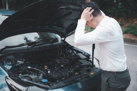 Téléchargez les photos : Asian businessman car broken breakdown, young stressed man having trouble car failure problem looking in frustration at failed engine in the morning, accident on road outdoor, late for work - en image libre de droit