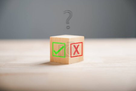 Photo for Wooden block featuring green check mark and red x. Conceptualizes choice and decision making. Think With Yes Or No Choice. - Royalty Free Image