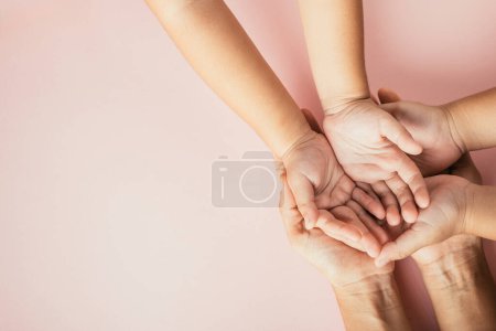 Photo for Family day celebration, Top view of parents and kid holding empty hands together isolated on color background. Space for text. - Royalty Free Image