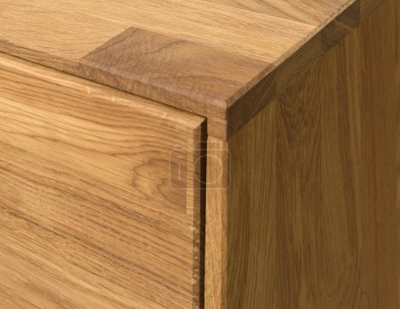 Foto de Wooden drawer close view photo, wooden eco furniture elements background. Solid wood furniture details - Imagen libre de derechos