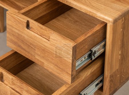 Foto de Opened drawers close view photo, wooden eco furniture elements background. Solid wood furniture details - Imagen libre de derechos