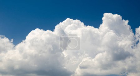 Photo for White clouds in deep blue summer sky, natural background, atmosphere photo wallpaper - Royalty Free Image