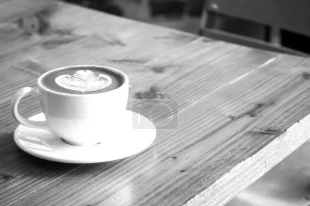 Photo for Coffee cup close vew black and white photo background, cup of tea or coffee on the table - Royalty Free Image