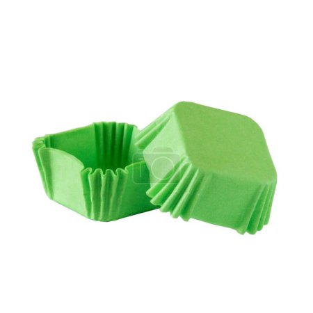 Green paper cupcake forms for baking isolated over white background, muffin forms object photography, confectionery baking forms clipart