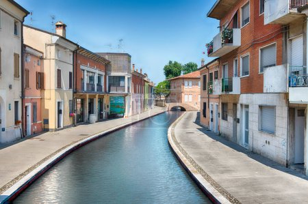 Walking in the centre of Comacchio, picturesque town with canals and bridges in the province of Ferrara, Italy
