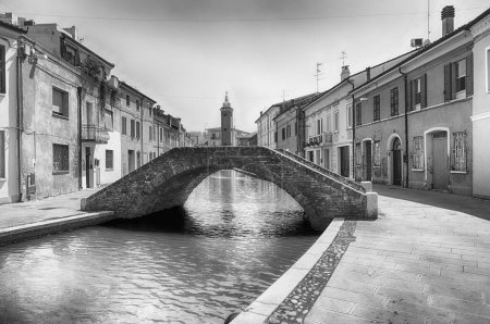 Walking in the centre of Comacchio, picturesque town with canals and bridges in the province of Ferrara, Italy