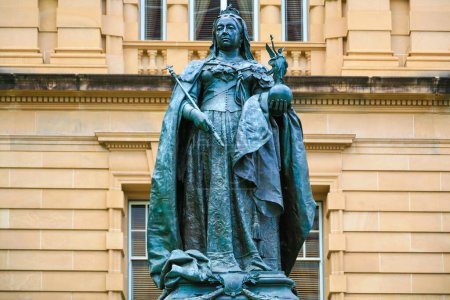 Photo for Brisbane, QLD, Australia - January 28, 2008 : Queen Victoria Monument. Statue of Queen Victoria in Queens Gardens in front of the Treasury Casino and Hotel. - Royalty Free Image