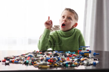 Photo for Boy playing with cubes idea smart development block emotions - Royalty Free Image