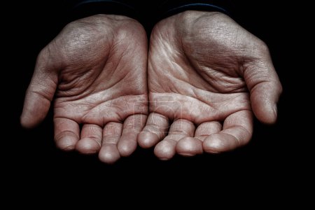 Photo for Hands of a begging poor man on the street bum - Royalty Free Image