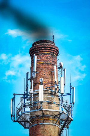 Foto de A High tower with an antenna on it danger to ecology in nature atmospheric pressure - Imagen libre de derechos