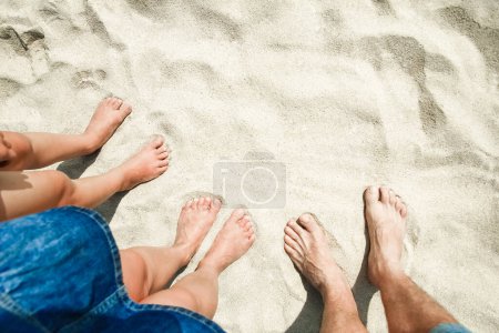 Photo for Beautiful legs in the sand of the sea greece background - Royalty Free Image