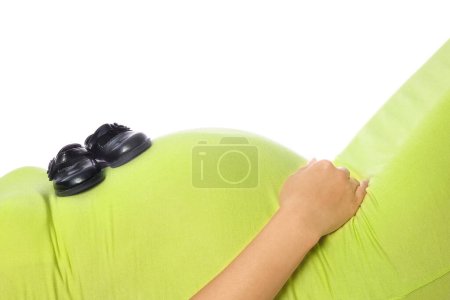 Photo for Happy pregnant girl lies on white background - Royalty Free Image