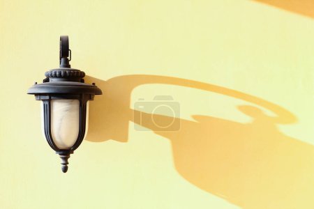 Photo for Stylishly beautiful lamp lamp with shadow on background - Royalty Free Image