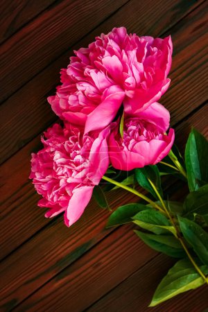 Photo for Peonies flowers on wooden background concept mothers day - Royalty Free Image