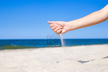 Photo for Stylish beautiful hands sypyat sand sea summer on the nature - Royalty Free Image